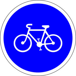 Panneau de circulation rond, bleu, avec un pictogramme de vélo blanc à l'intérieur.