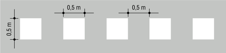 Ligne de cédez-le-passage, carrés blancs de 50 cm de côté espacés eux-mêmes de 50 cm.